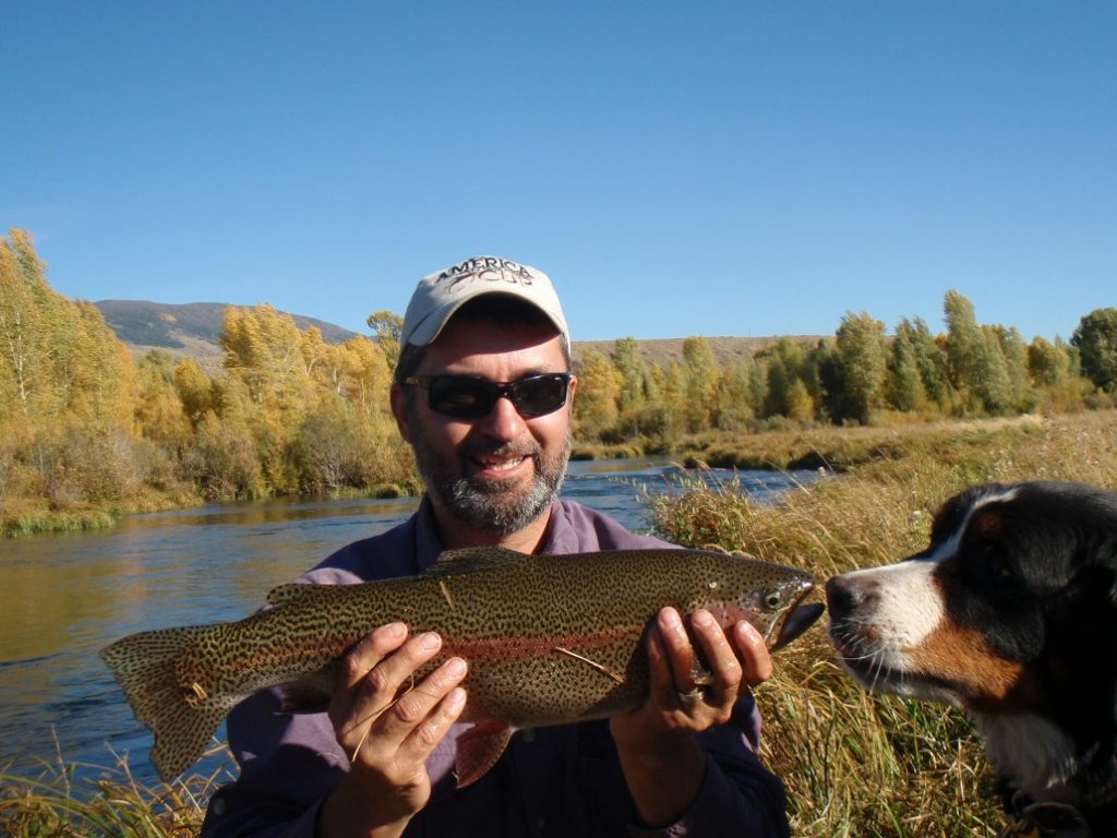 lawrence with 24" trout and dog