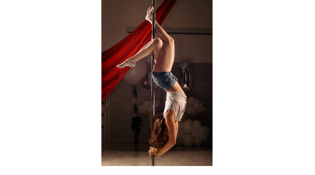 Woman pole dancing