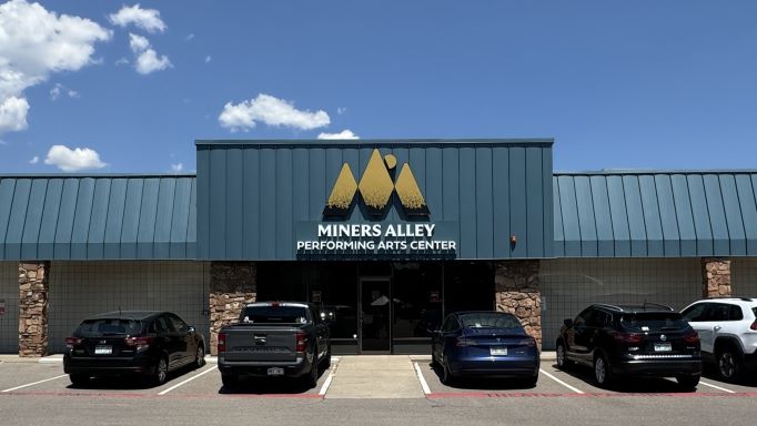 The front of the Miners Alley Performing Arts Center on a sunny day