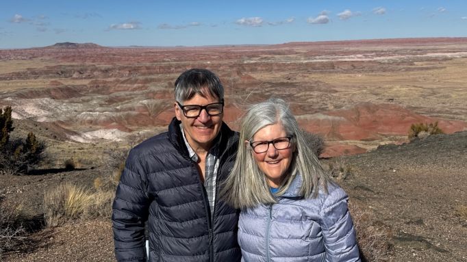 Photo of Pete and Nancy Torpey at the Painted Desert on a cold, windy, and sunny day.