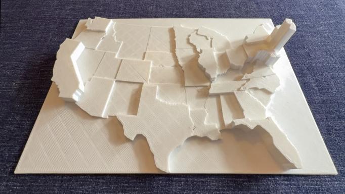 3D printed map of the 48 contiguous United States in which each state's relative population density is represented by its height.