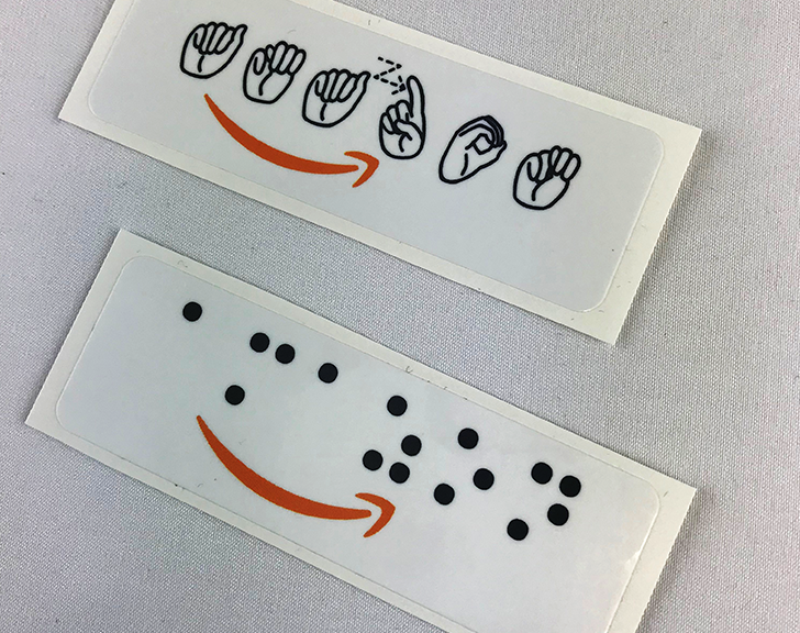 Amazon logo in Braille and ASL