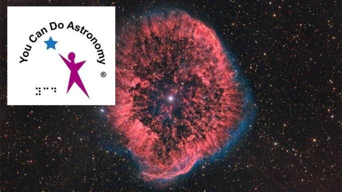 Logo of You Can Do Astronomy with the words in black, Braille 'YCD' in black and a representation of a magenta figure reaching for a blue star, all on a white background. The rest of the image is a false color photograph of Nebula RCW 58 .